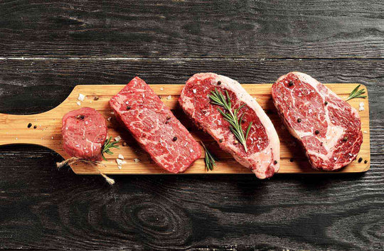 ZFF Beef steaks on wood cutting board