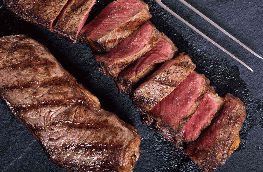 New York Strip, a premium lean steak is known for its marbling, flavor, and tenderness.