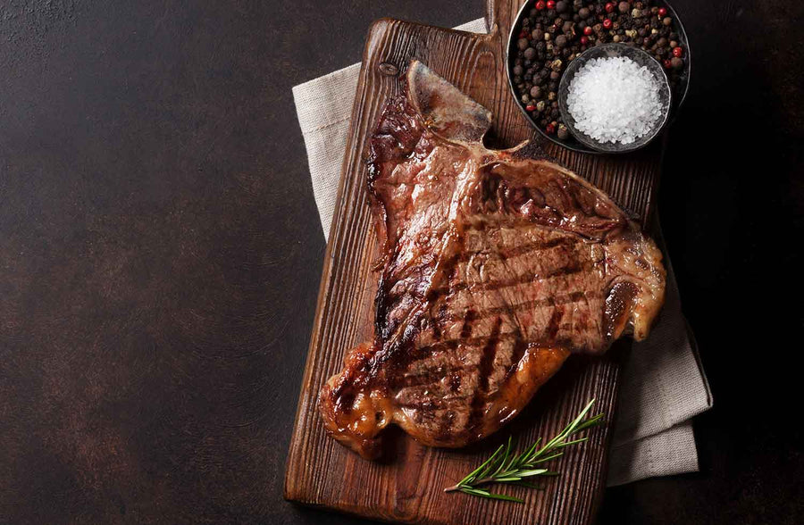 T-Bone Steaks consist of two lean, but well-marbled tender steaks (Strip & Tenderloin) connected by a T-shaped bone.